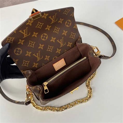 lv pochette metis east west.